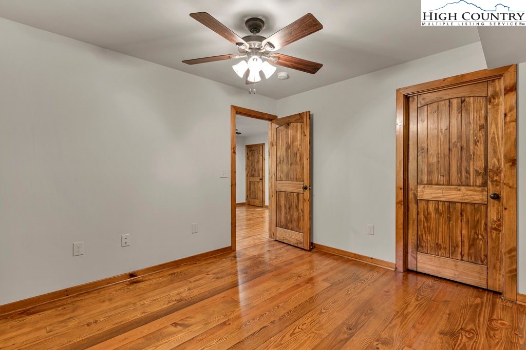 359 Sorrento Falls Road Blowing Rock, NC 28605 - Photo 42 of 46 wooden floor in an empty room with a window