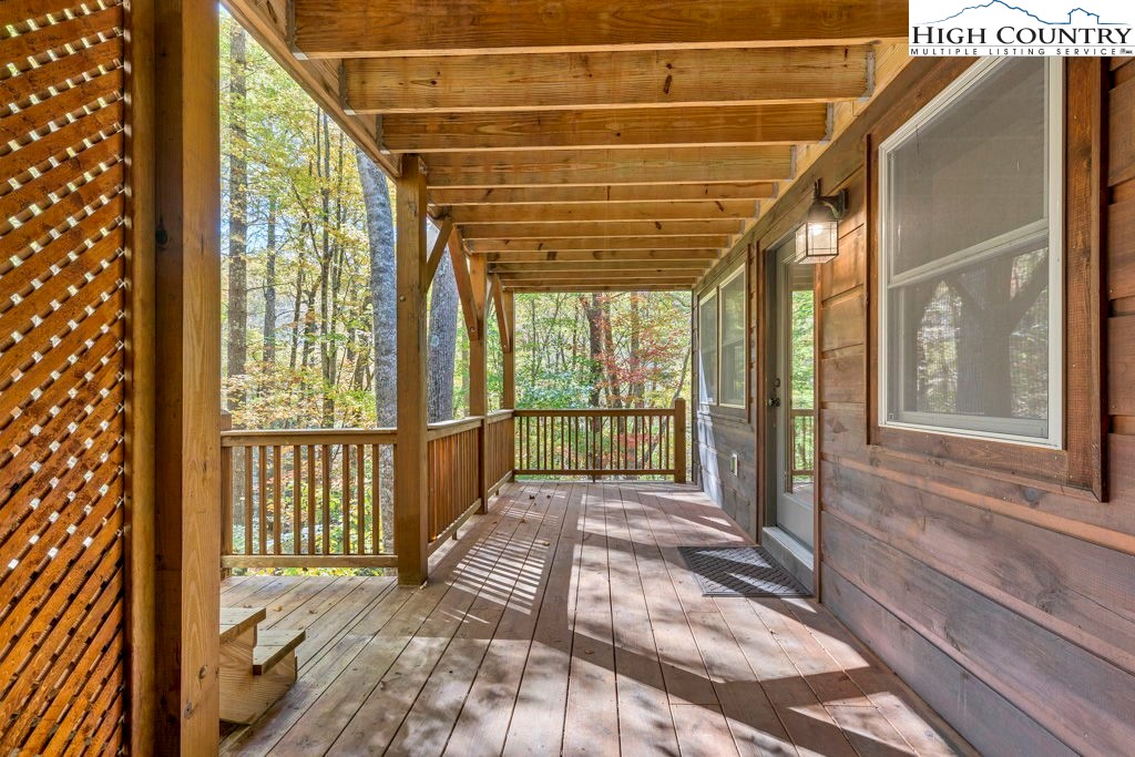 359 Sorrento Falls Road Blowing Rock, NC 28605 - Photo 43 of 46 a view of a porch with wooden floor and windows
