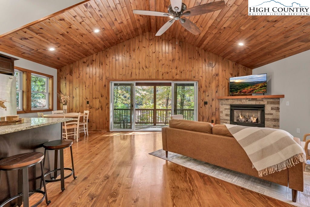 359 Sorrento Falls Road Blowing Rock, NC 28605 - Photo 10 of 46 a living room with furniture a fireplace and a table