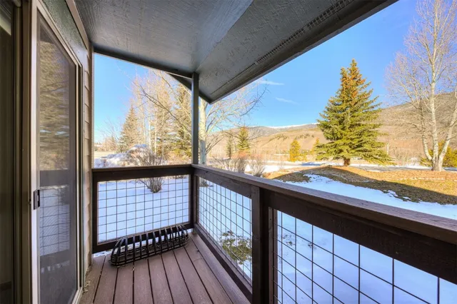 a view of balcony with wooden floor