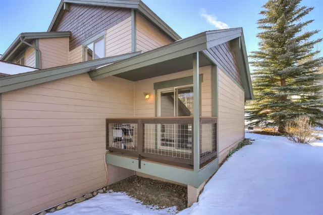 a view of front of house with large windows