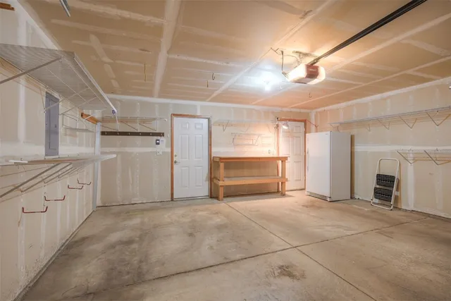 a view of a kitchen with an empty space and a window
