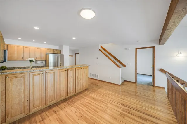 a view of kitchen with wooden floor