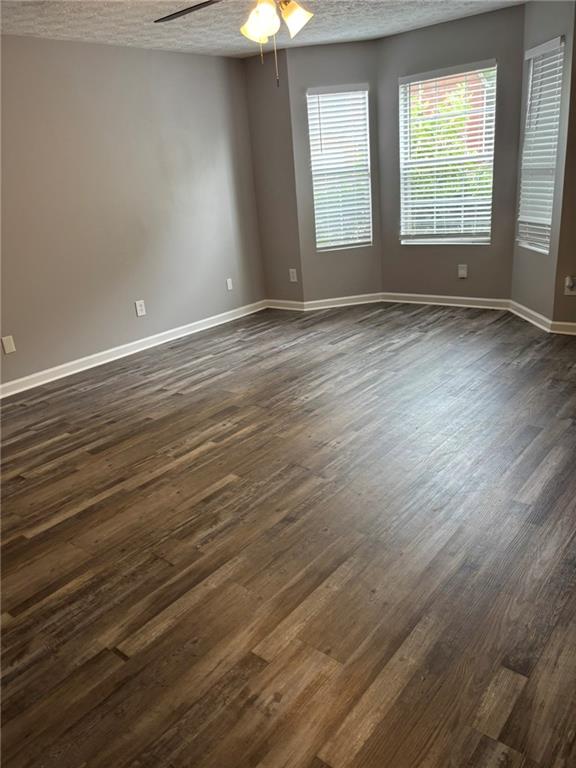 5739 Windfall Lane Lithonia, GA 30058 - Photo 6 of 36 wooden floor in an empty room with a window