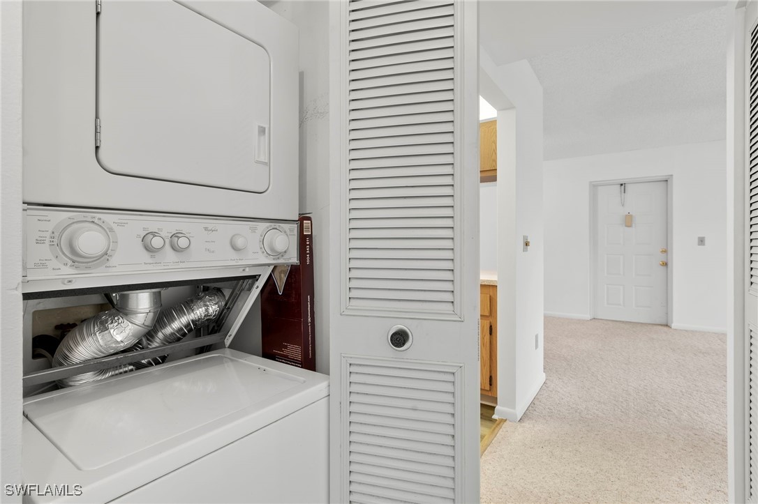 9970 Sailview Court, Unit 9 Fort Myers, FL 33905 - Photo 12 of 20 a utility room with dryer and washer