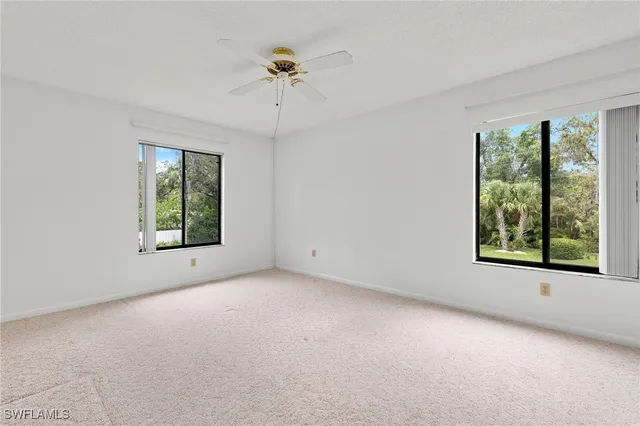 an empty room with windows