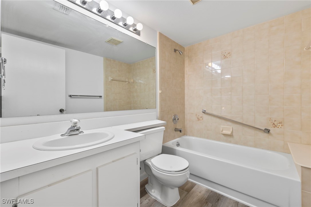 9970 Sailview Court, Unit 9 Fort Myers, FL 33905 - Photo 18 of 20 a bathroom with a sink a toilet and shower