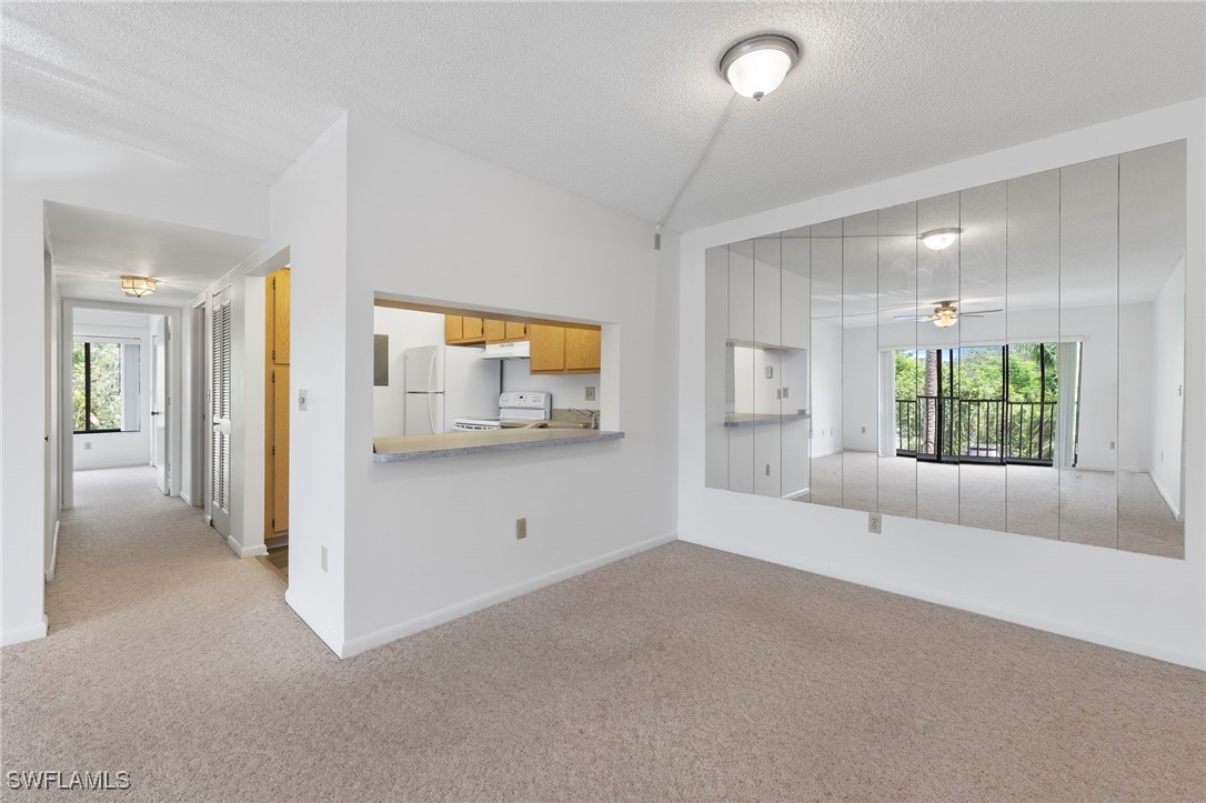 9970 Sailview Court, Unit 9 Fort Myers, FL 33905 - Photo 10 of 20 a view of empty room with a window and fireplace