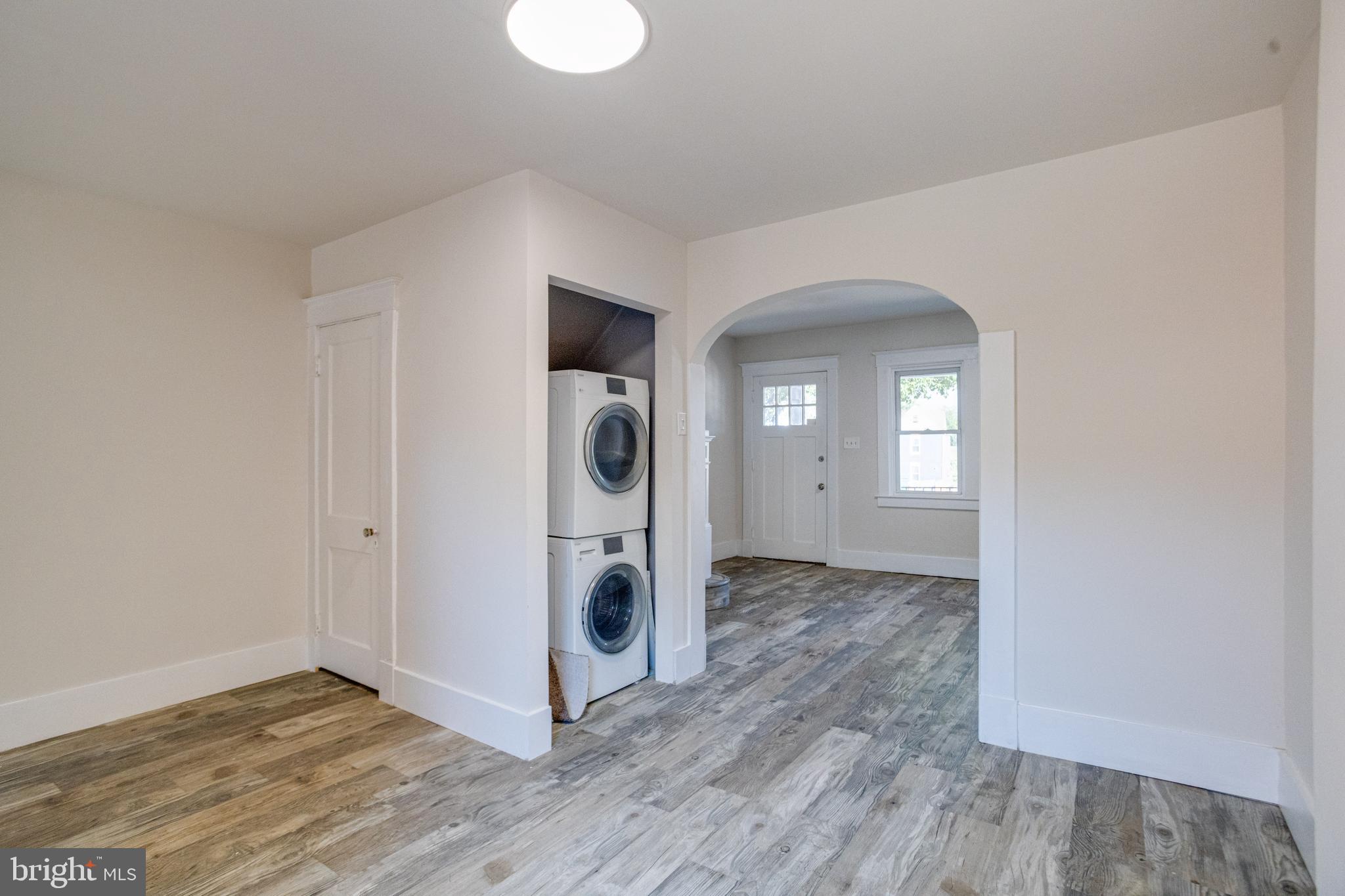 5878 Belair Road Baltimore, MD 21206 - Photo 8 of 41 a view of a storage & utility room with wooden floor