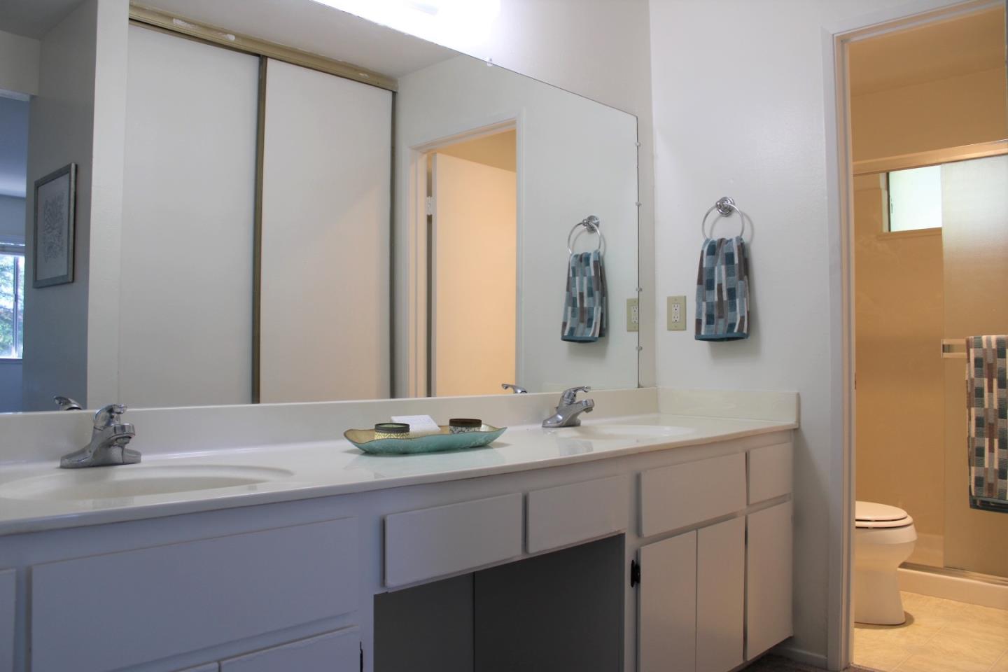 2298 Almaden Road, Unit B San Jose, CA 95125 - Photo 16 of 21 a bathroom with a granite countertop sink a toilet and a mirror