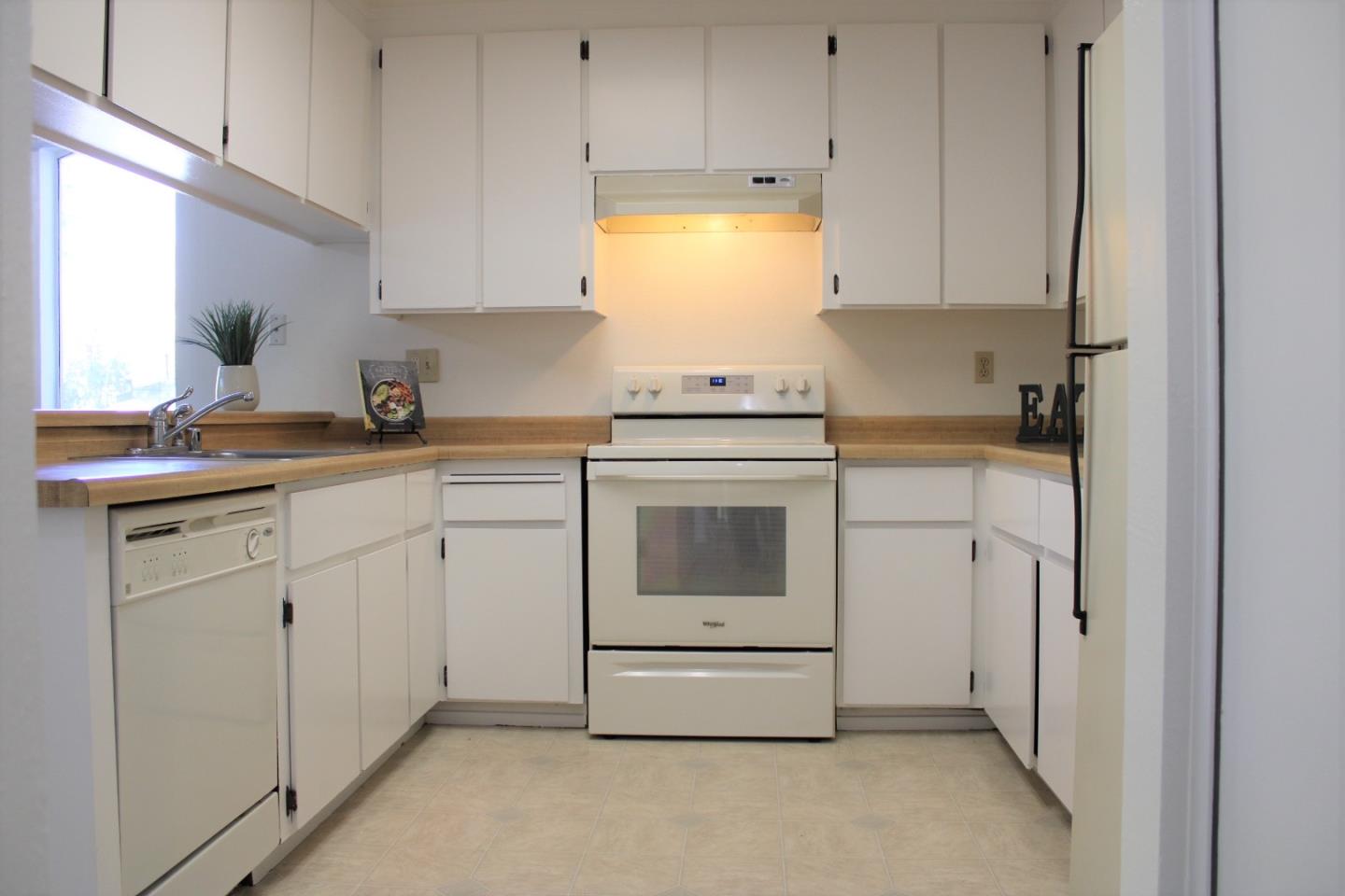 2298 Almaden Road, Unit B San Jose, CA 95125 - Photo 8 of 21 a kitchen with white cabinets and white appliances
