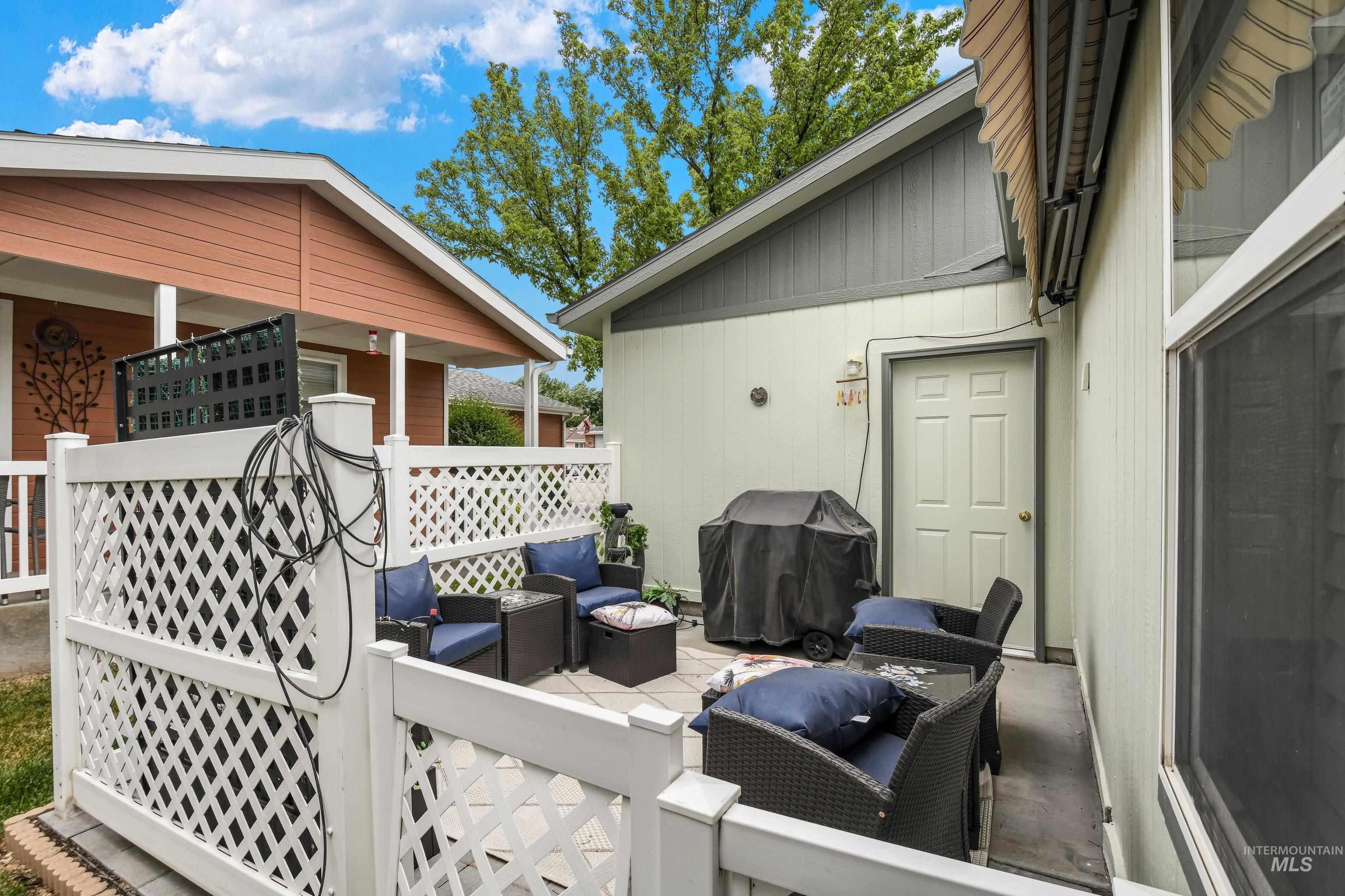 421 South Curtis Road, Unit 202 202 Boise, ID 83705 - Photo 23 of 41 Spacious garage with a sectional overhead door, exposed garage door opener, concrete flooring, and built-in shelving