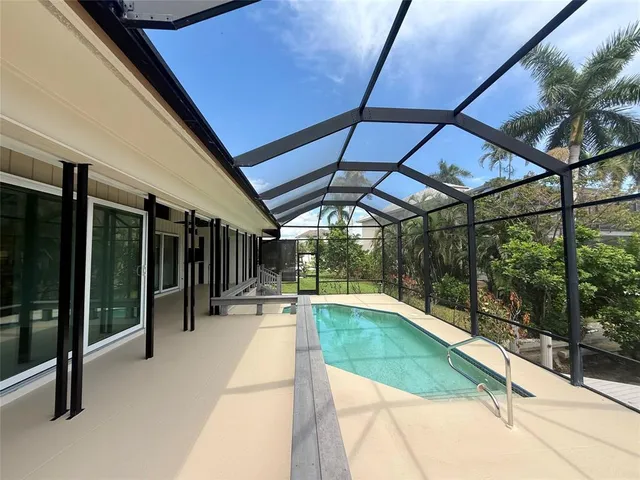 a view of swimming pool with a patio