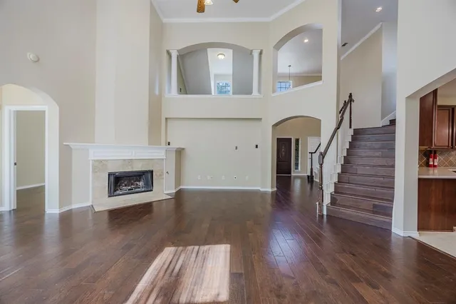 a view of livingroom with wooden floor and a fireplace