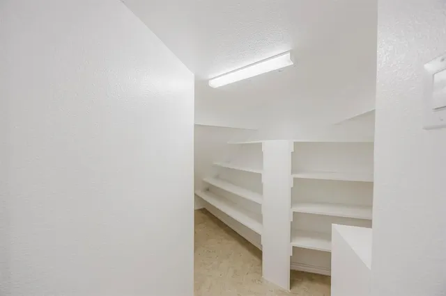 a view of an empty walk in closet