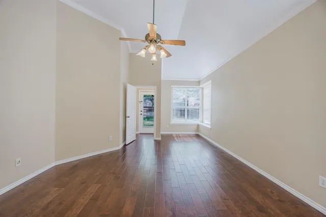a view of wooden floor and chandelier in a room