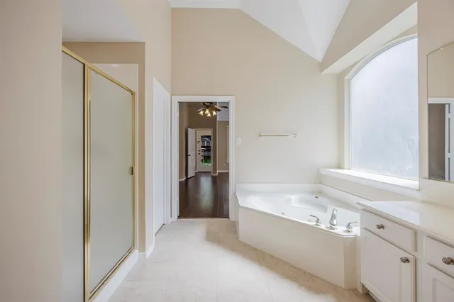 a bathroom with a bathtub and a shower