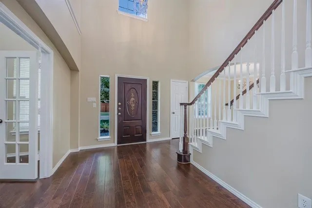 a view of entryway with wooden floor