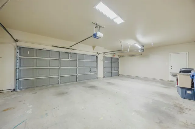 an empty room with a empty space and windows