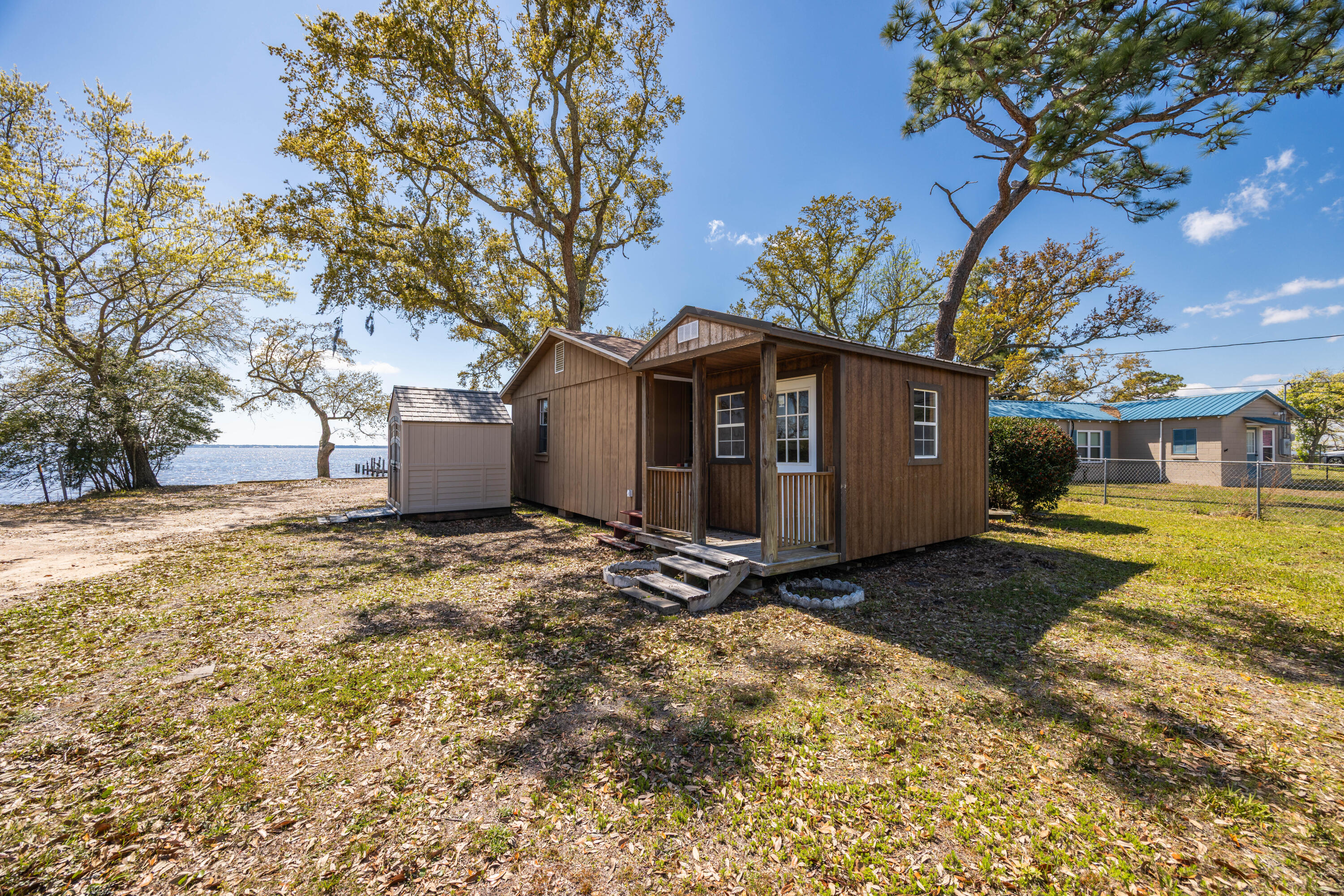 2894 Bay Grove Road Freeport, FL 32439 - Photo 11 of 29 a view of a house with a yard and large tree