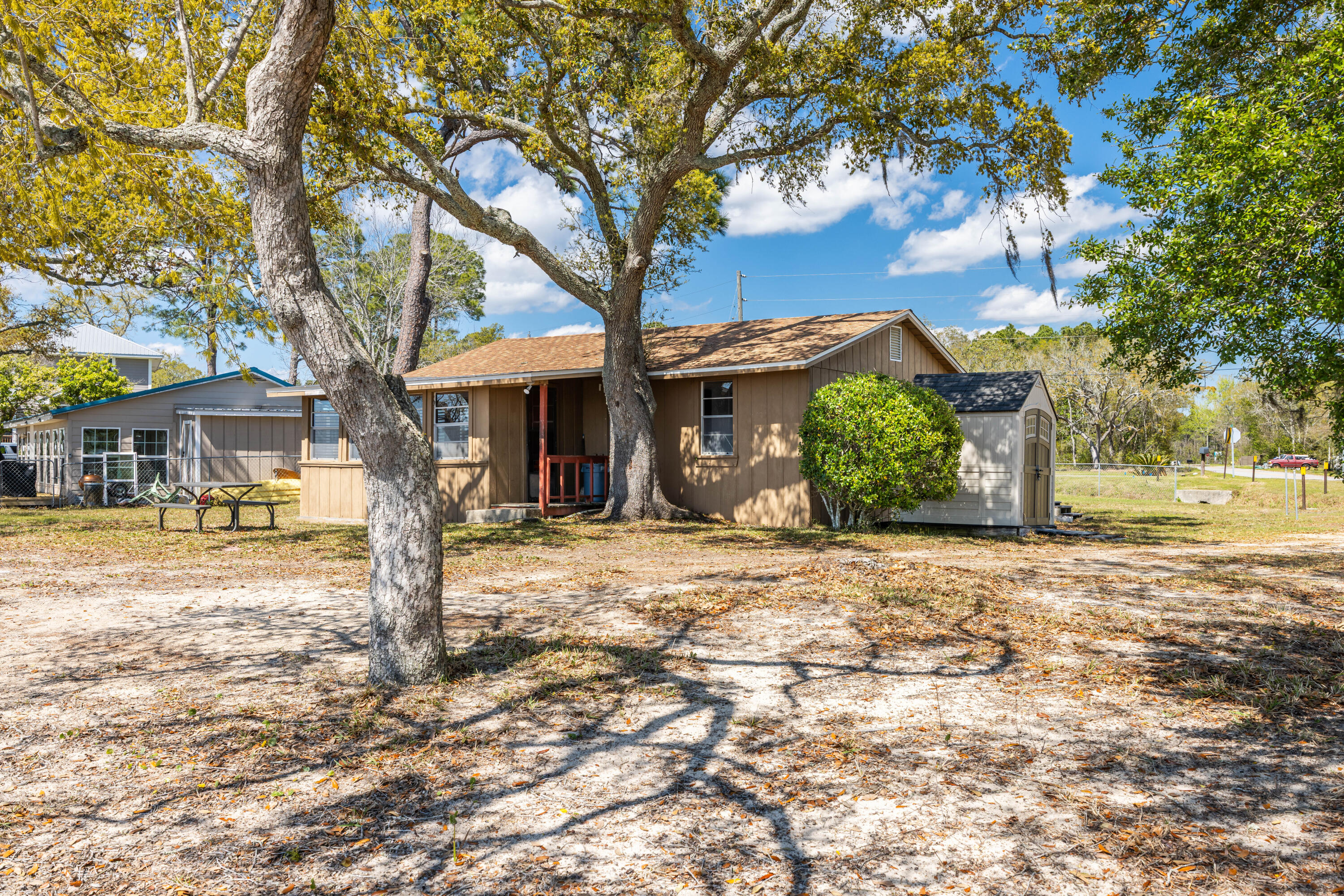 2894 Bay Grove Road Freeport, FL 32439 - Photo 14 of 29 a front view of a house with garden