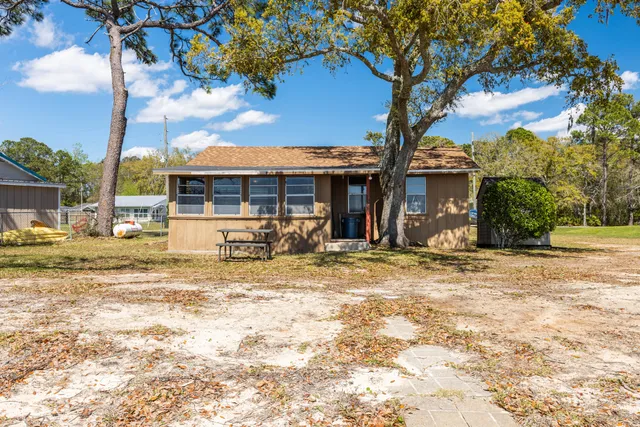a swimming pool with an outdoor space and seating area
