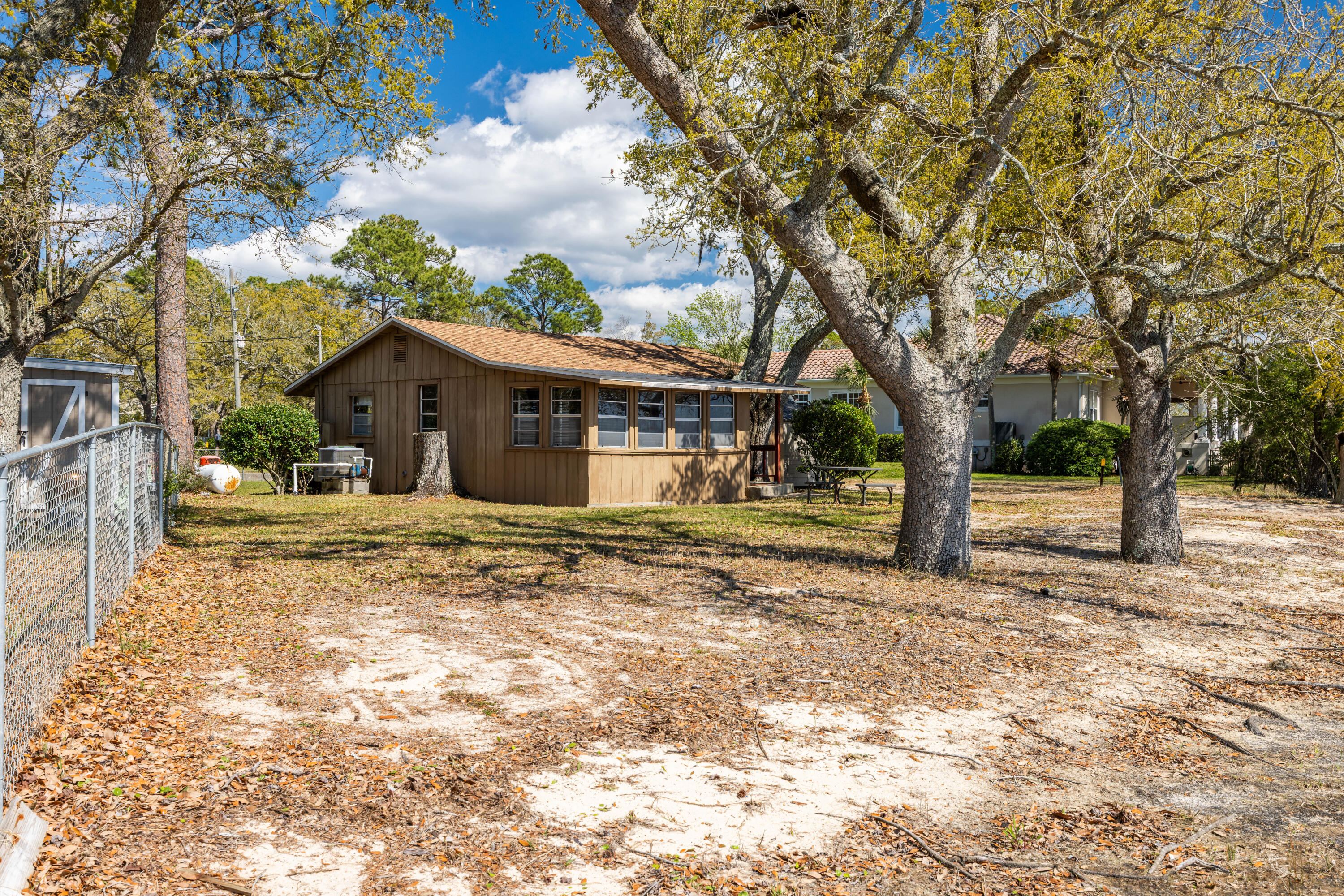 2894 Bay Grove Road Freeport, FL 32439 - Photo 16 of 29 a view of a house with a tree in the background