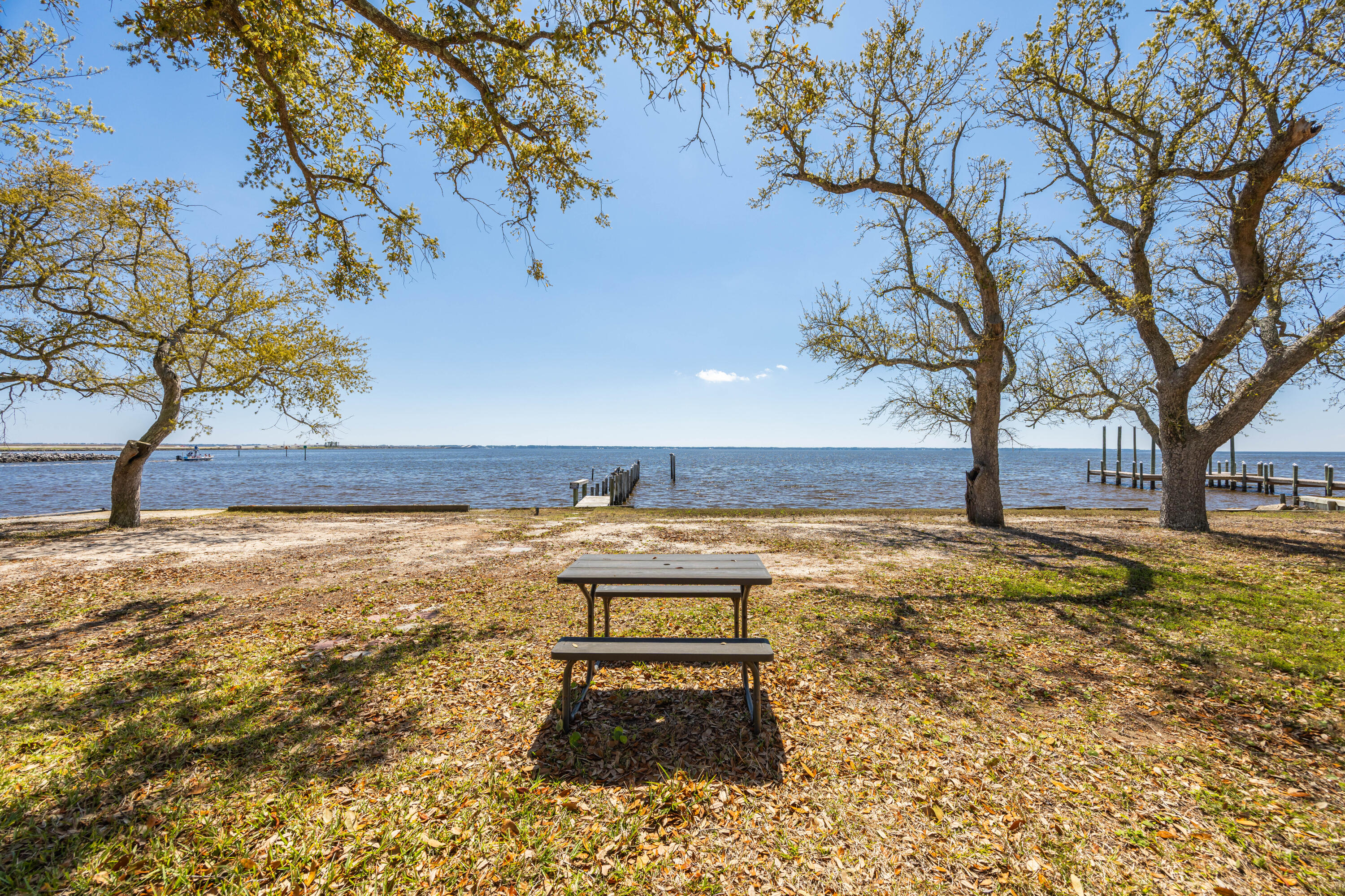2894 Bay Grove Road Freeport, FL 32439 - Photo 18 of 29 a swimming pool with an outdoor space and seating area
