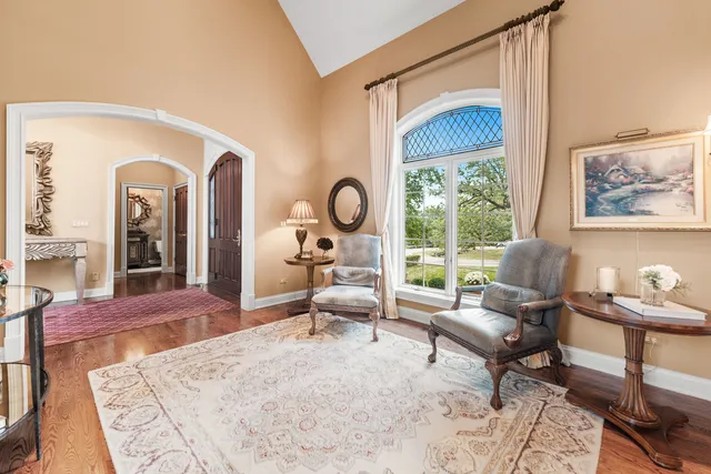 a bed room with a bed and a chair