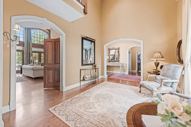 a view of entryway and hall with wooden floor