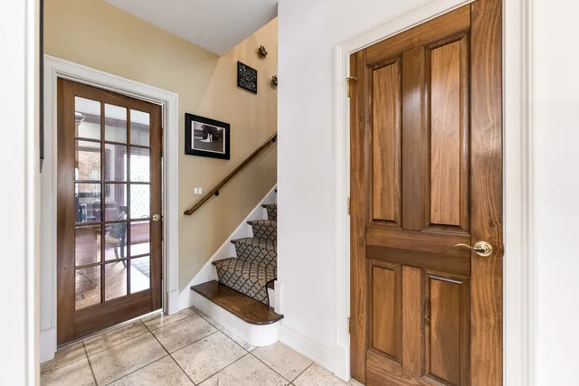 a front view of a house with outdoor seating