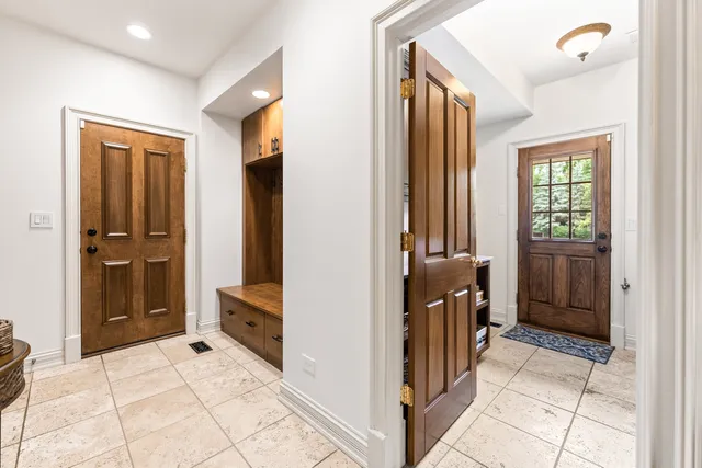 a view of a house with a wooden fence
