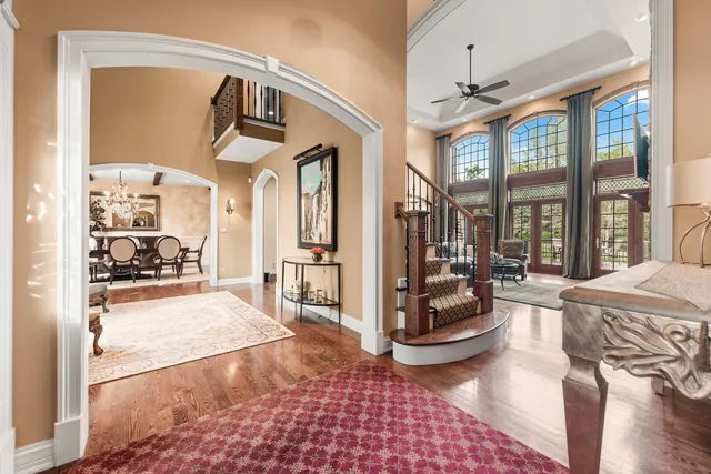 a kitchen with stainless steel appliances granite countertop a stove a sink a refrigerator and a oven