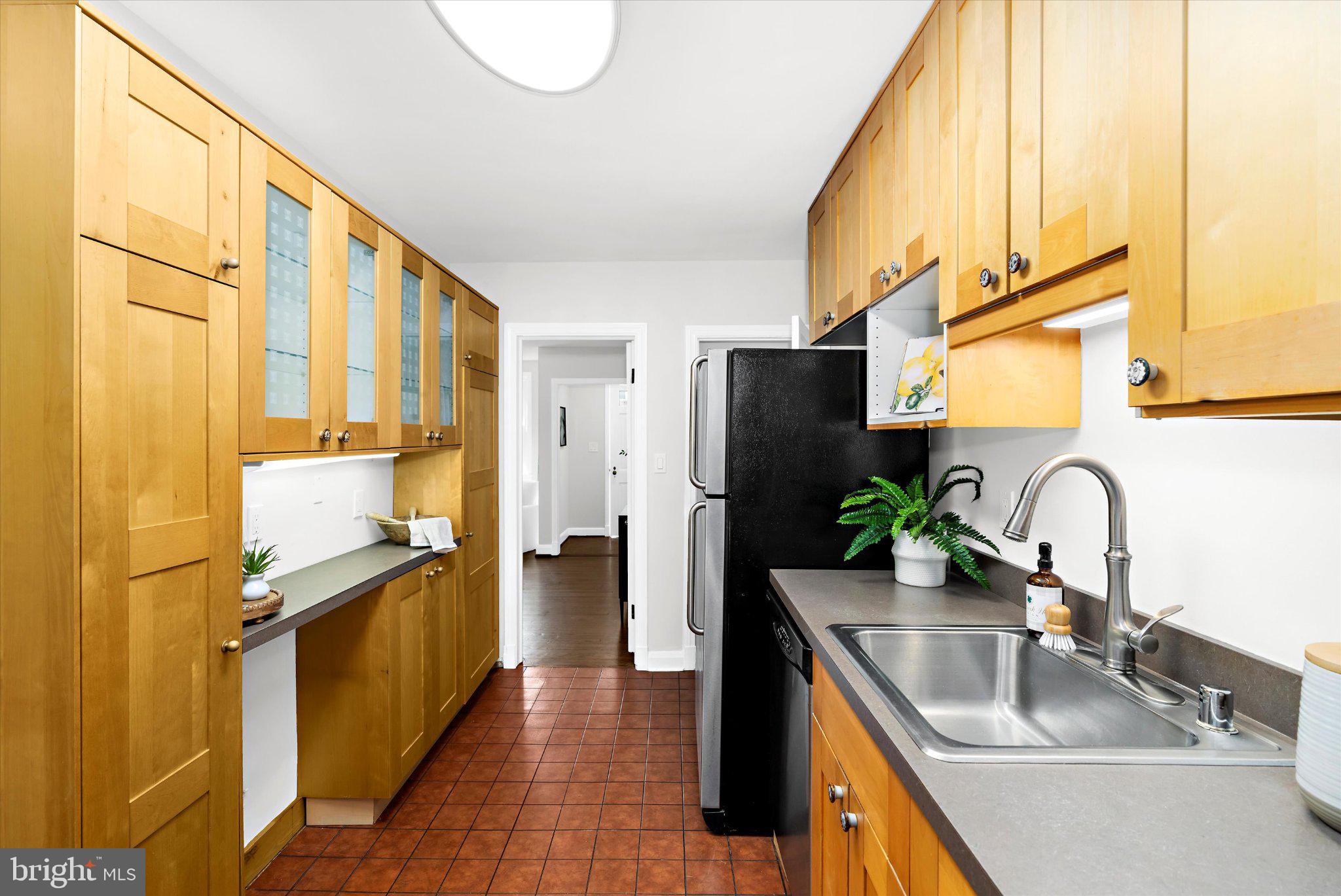 218 Blenheim Road Baltimore, MD 21212 - Photo 11 of 31 a kitchen with stainless steel appliances granite countertop a sink and a refrigerator