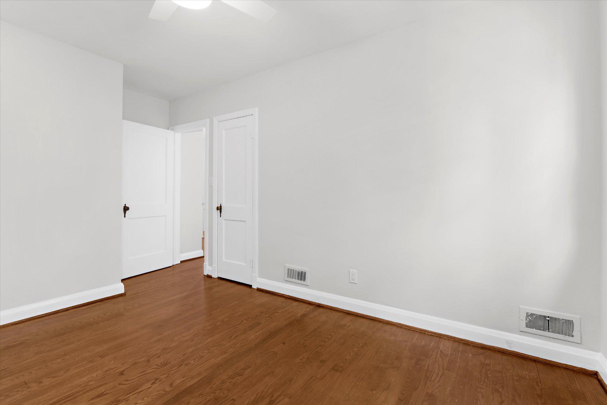 218 Blenheim Road Baltimore, MD 21212 - Photo 20 of 31 a view of an empty room with wooden floor
