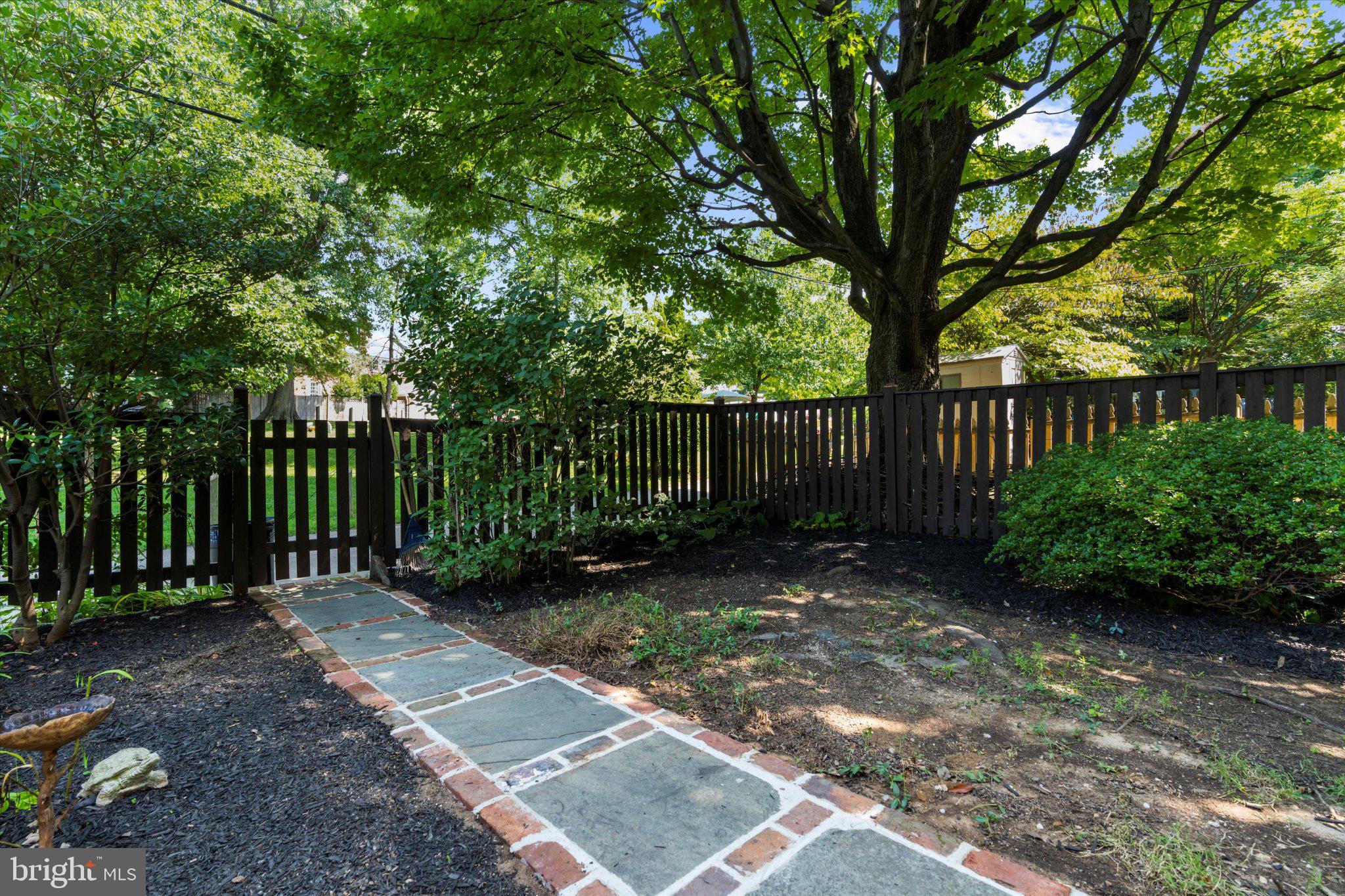 218 Blenheim Road Baltimore, MD 21212 - Photo 28 of 31 a view of a park with a large trees and wooden fence