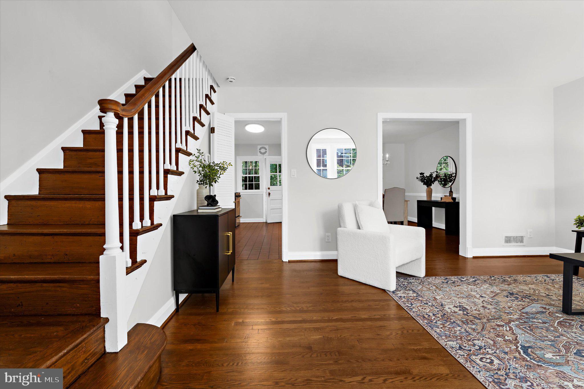 218 Blenheim Road Baltimore, MD 21212 - Photo 3 of 31 a living room with couches and paintings on the wall