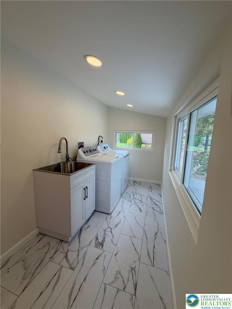5111 Vera Cruz Road Emmaus, PA 18049 - Photo 32 of 44 Polished tile flooring and clean lines define this functional workspace featuring a modern utility sink.