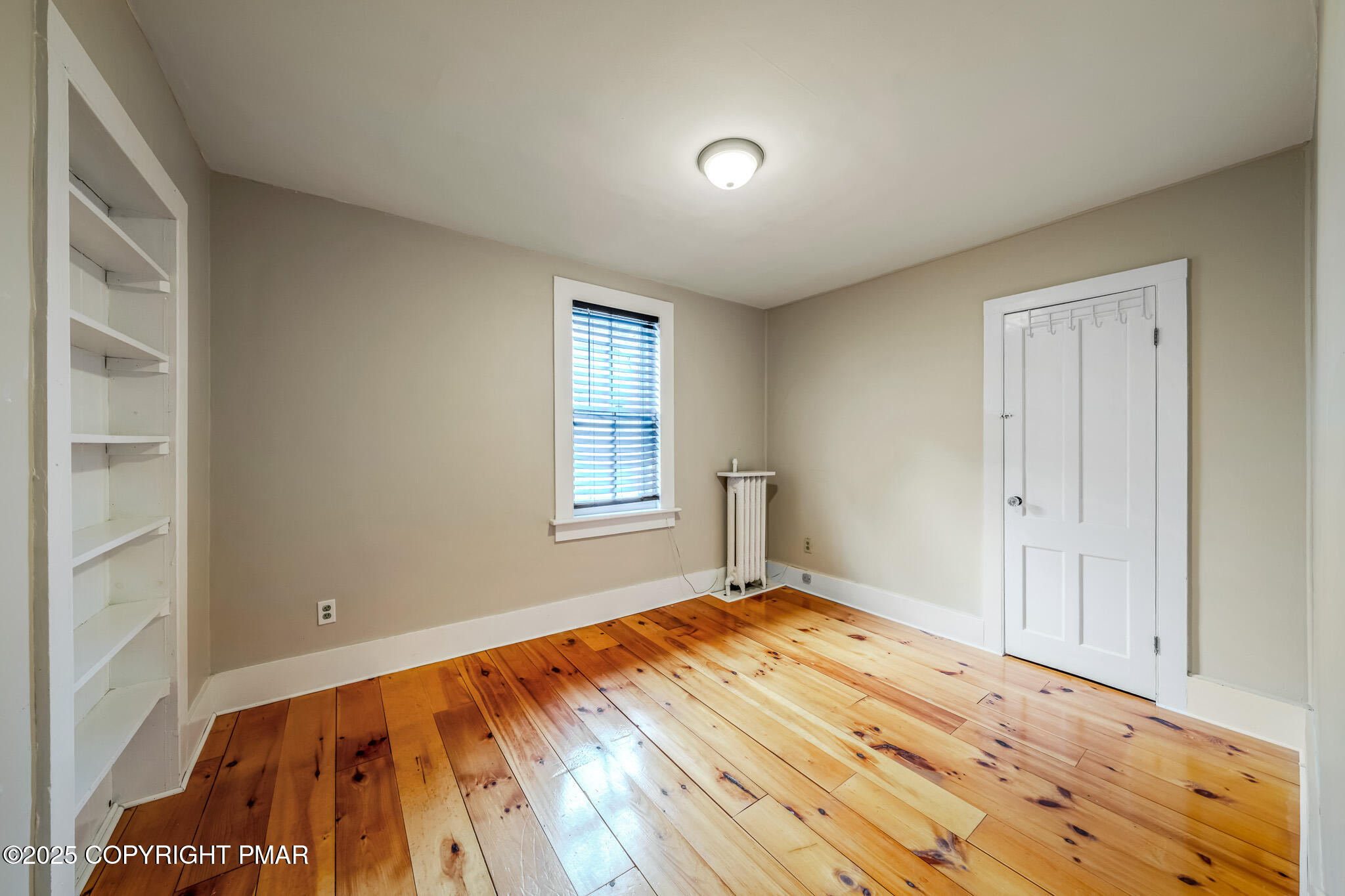 703 Scott Street Stroudsburg, PA 18360 - Photo 17 of 27 a view of empty room with wooden floor and fan