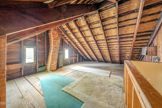 a view of an empty room with windows