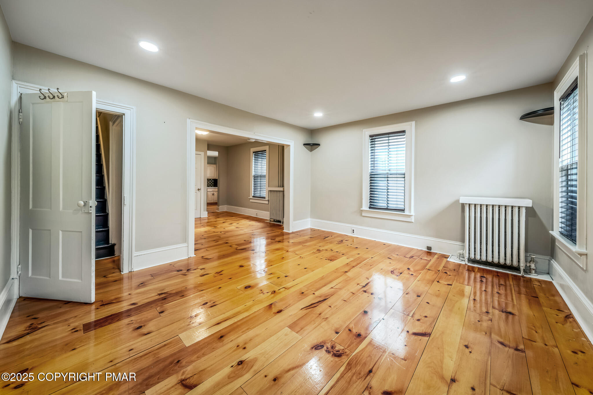 703 Scott Street Stroudsburg, PA 18360 - Photo 2 of 27 an empty room with wooden floor and windows