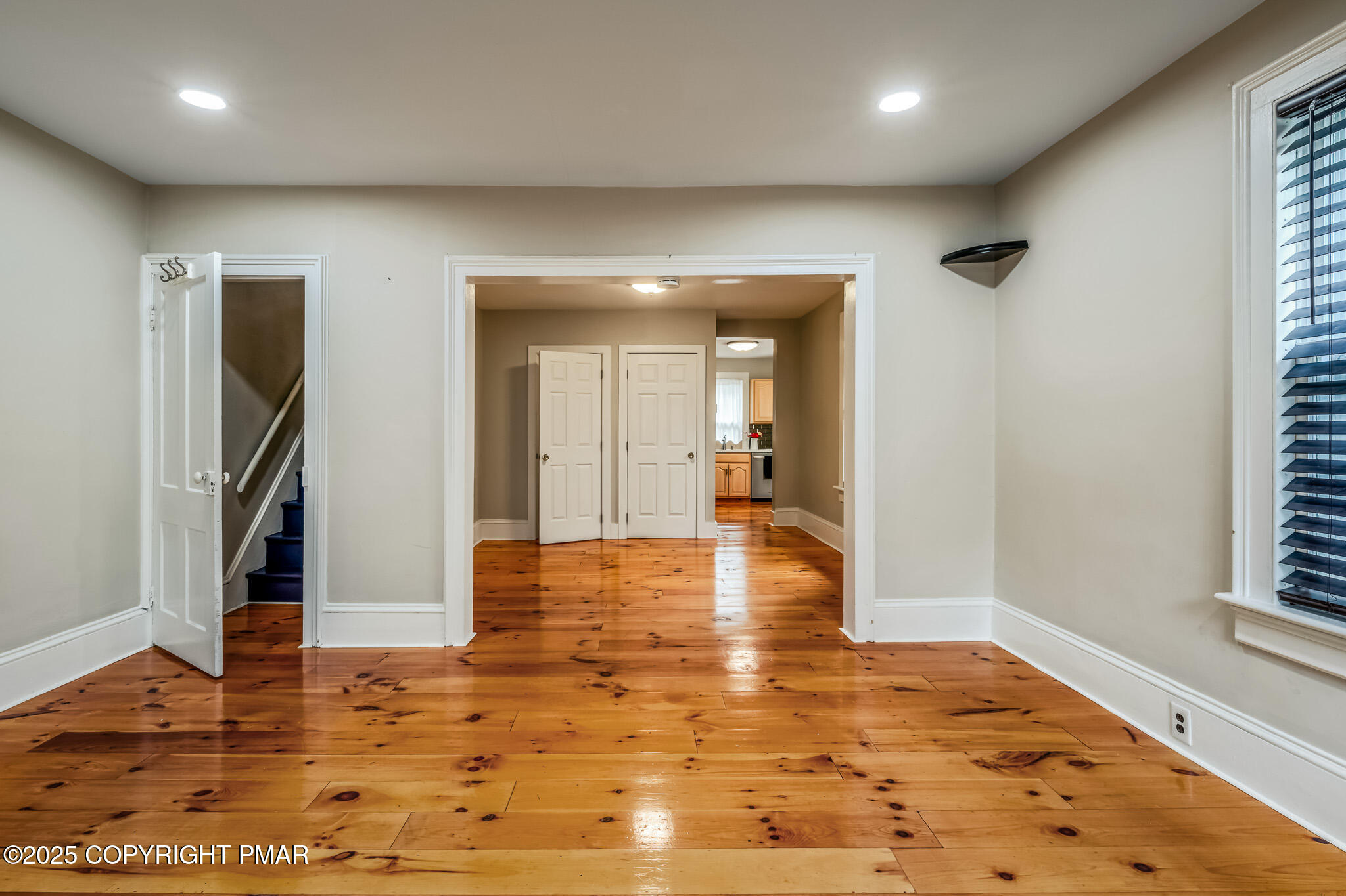 703 Scott Street Stroudsburg, PA 18360 - Photo 3 of 27 an empty room with wooden floor and a window