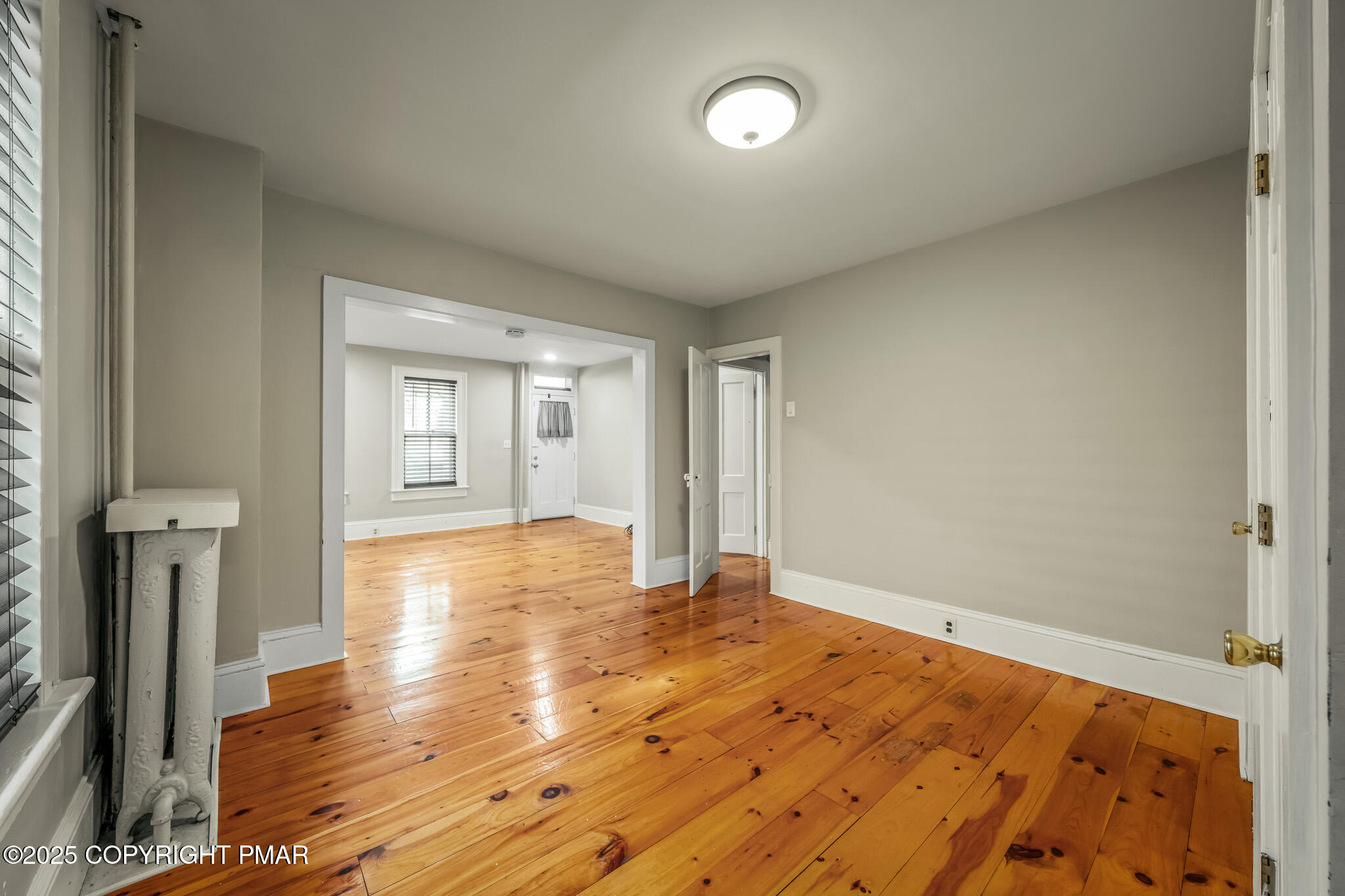703 Scott Street Stroudsburg, PA 18360 - Photo 4 of 27 a view of empty room with wooden floor and front door