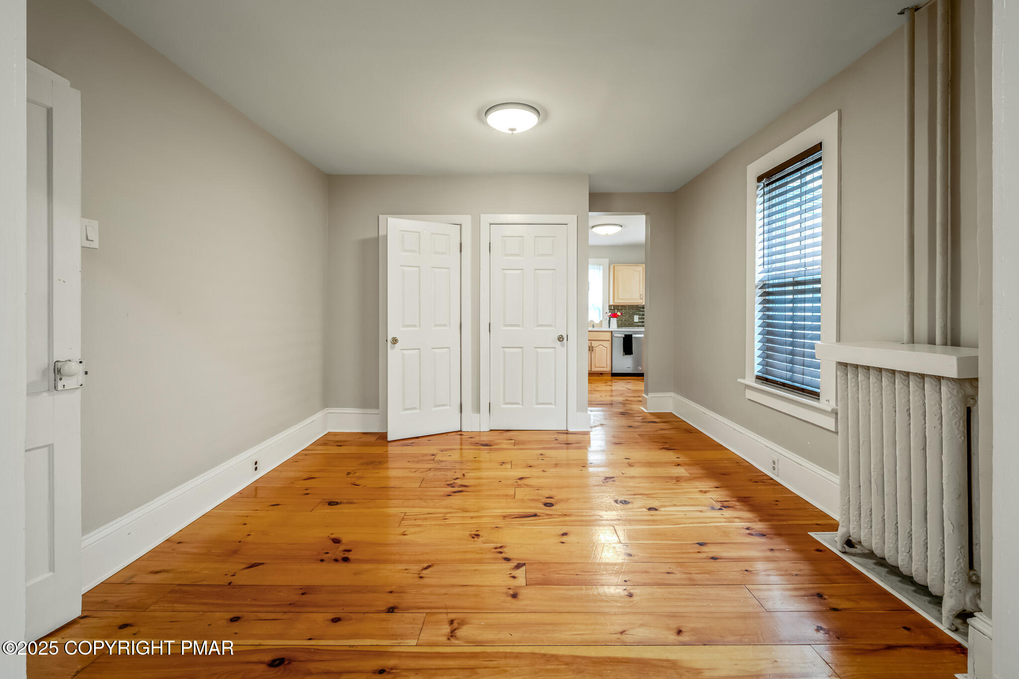 703 Scott Street Stroudsburg, PA 18360 - Photo 5 of 27 a view of an empty room with wooden floor