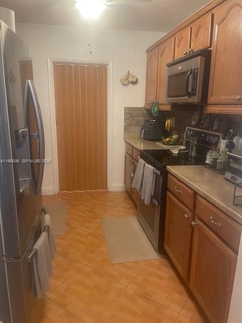 11775 Southwest 173rd Terrace Miami, FL 33177 - Photo 4 of 25 Marble counters, refrigerator stove and microwave. Kitchen cabinets.