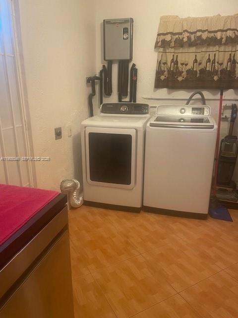 11775 Southwest 173rd Terrace Miami, FL 33177 - Photo 6 of 25 Washer dryer. Also serves as a utility room. Has a small refrigerator.