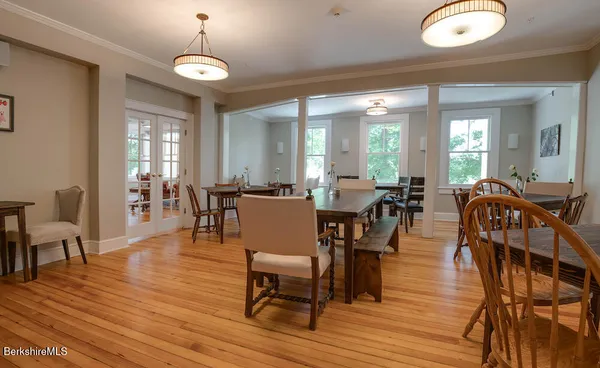 a view of a dining room with furniture window and wooden floor