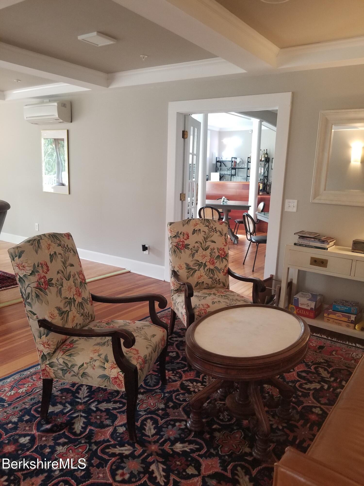 615 Laurel Street Lee, MA 01238 - Photo 8 of 20 a room with furniture a rug and a chandelier