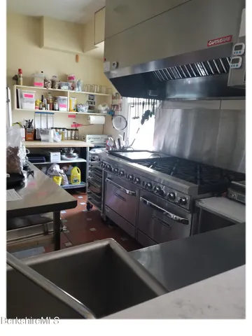 a kitchen with lots of appliances