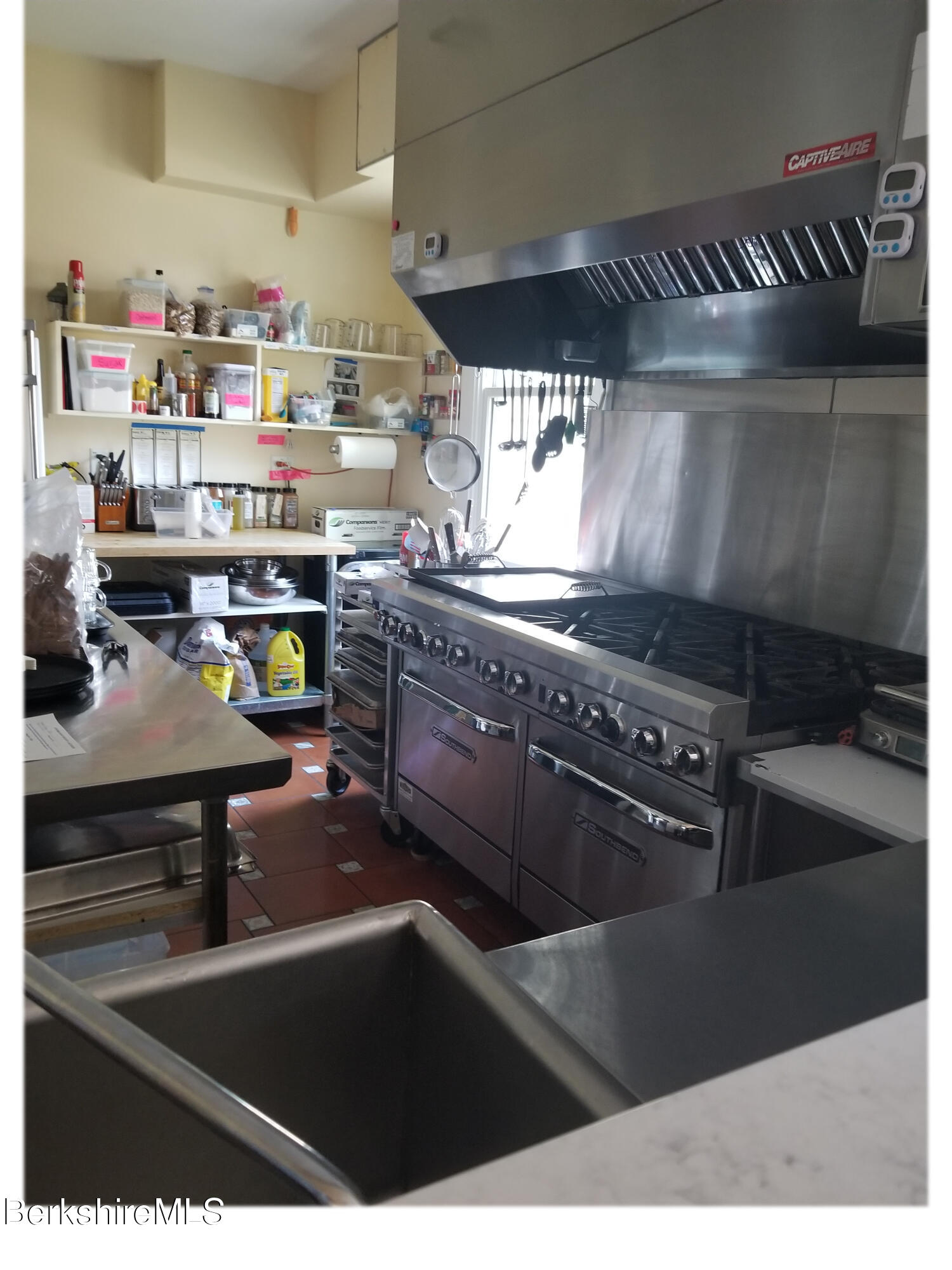 615 Laurel Street Lee, MA 01238 - Photo 9 of 20 a kitchen with lots of appliances